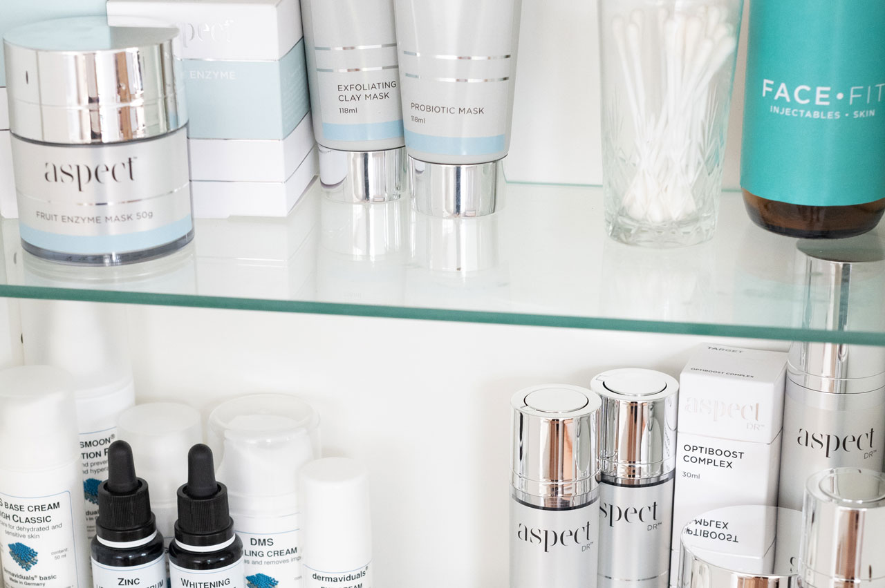 Two shelves of facial skin care products