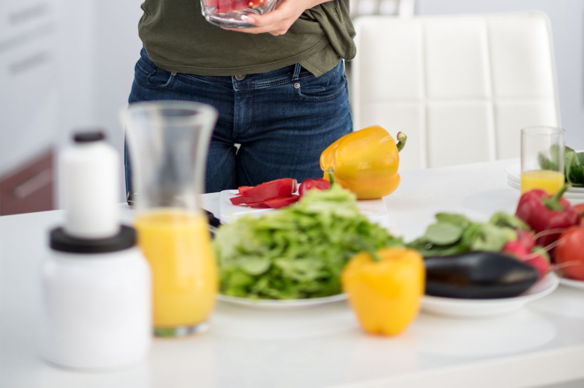 Selection of healthy foods with woman in background