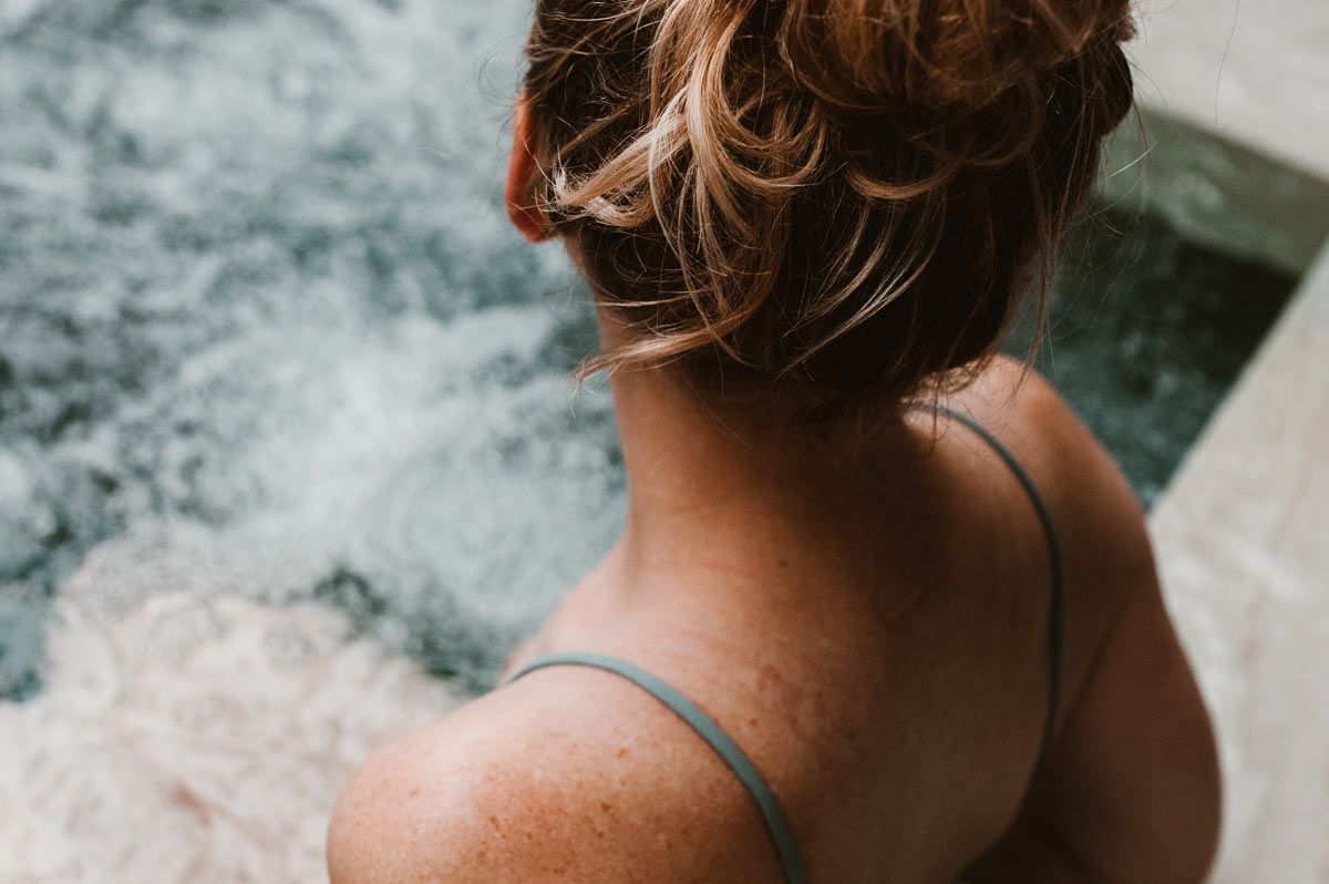 Woman relaxing in a wellness pool