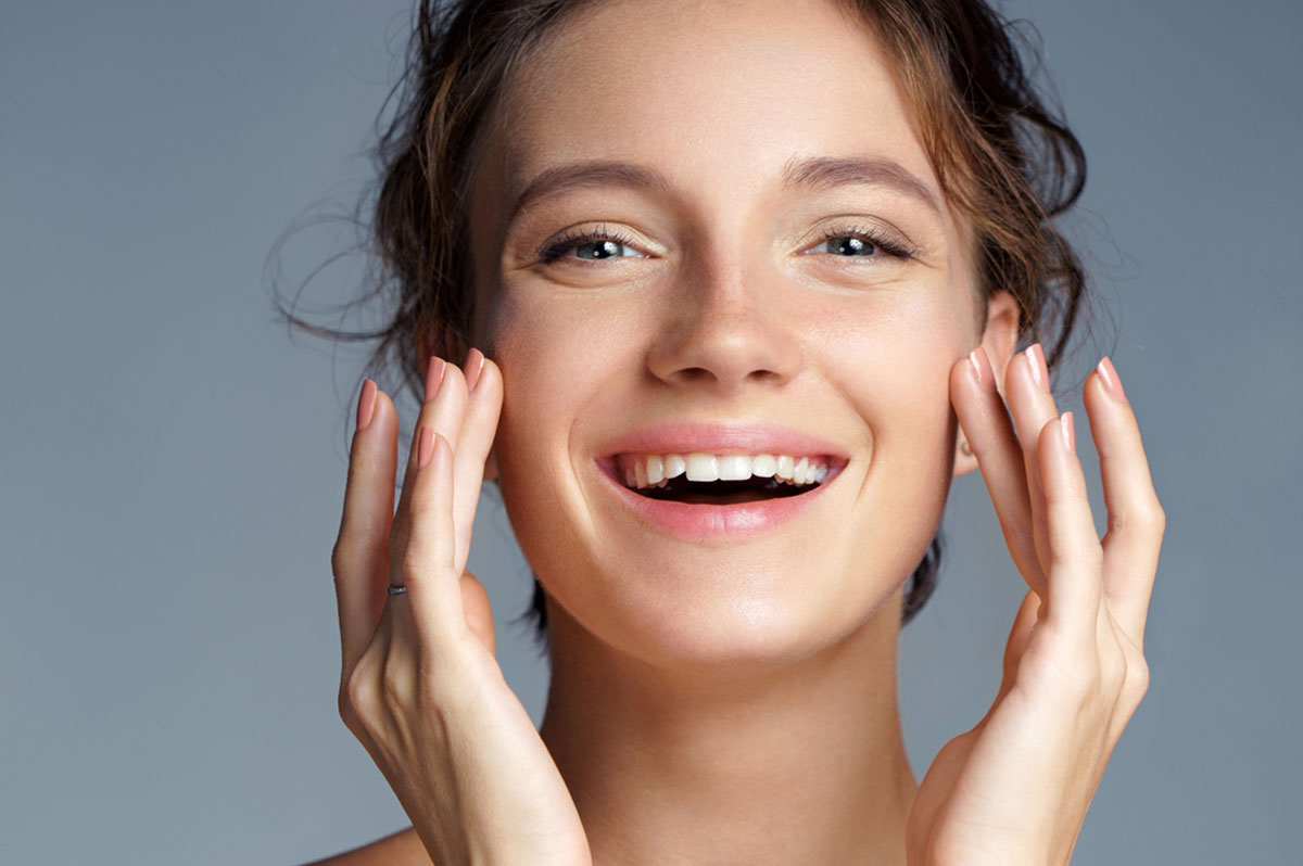 Close up of smiling woman with healthy skin follwoing the dietary tips for Optimal Skin and Ageing
