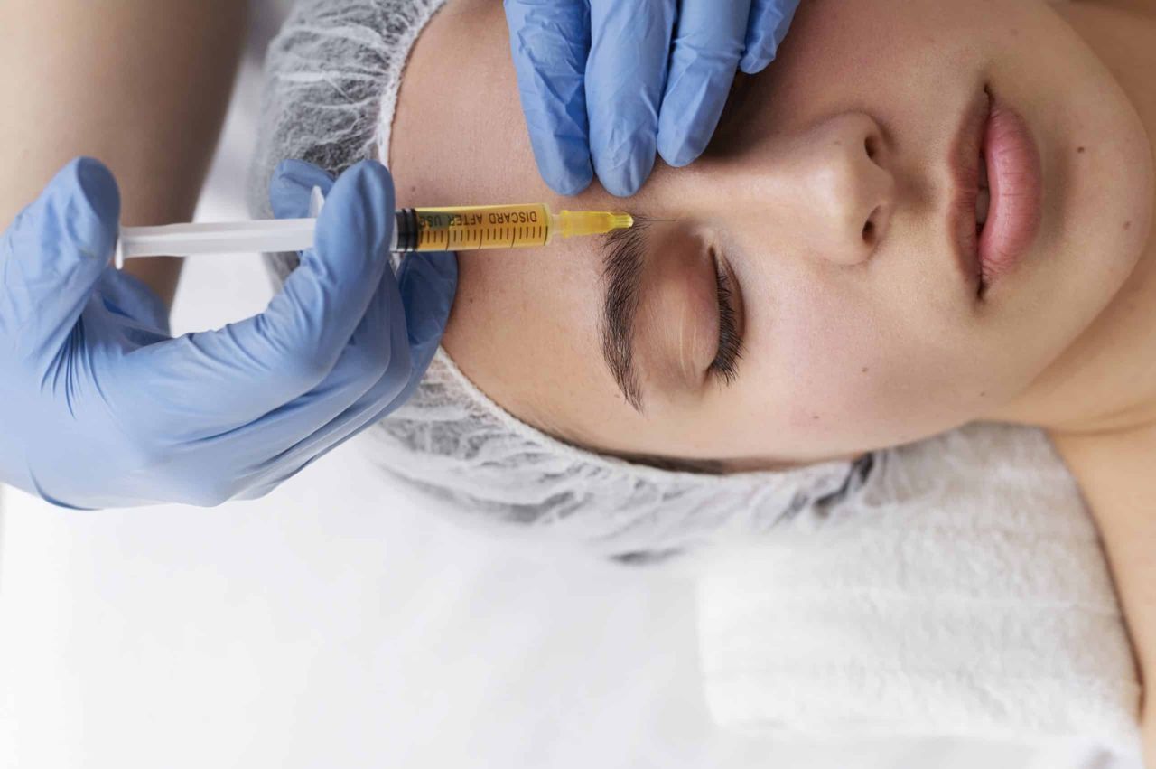 Close up of woman's face receiving PRP treatment