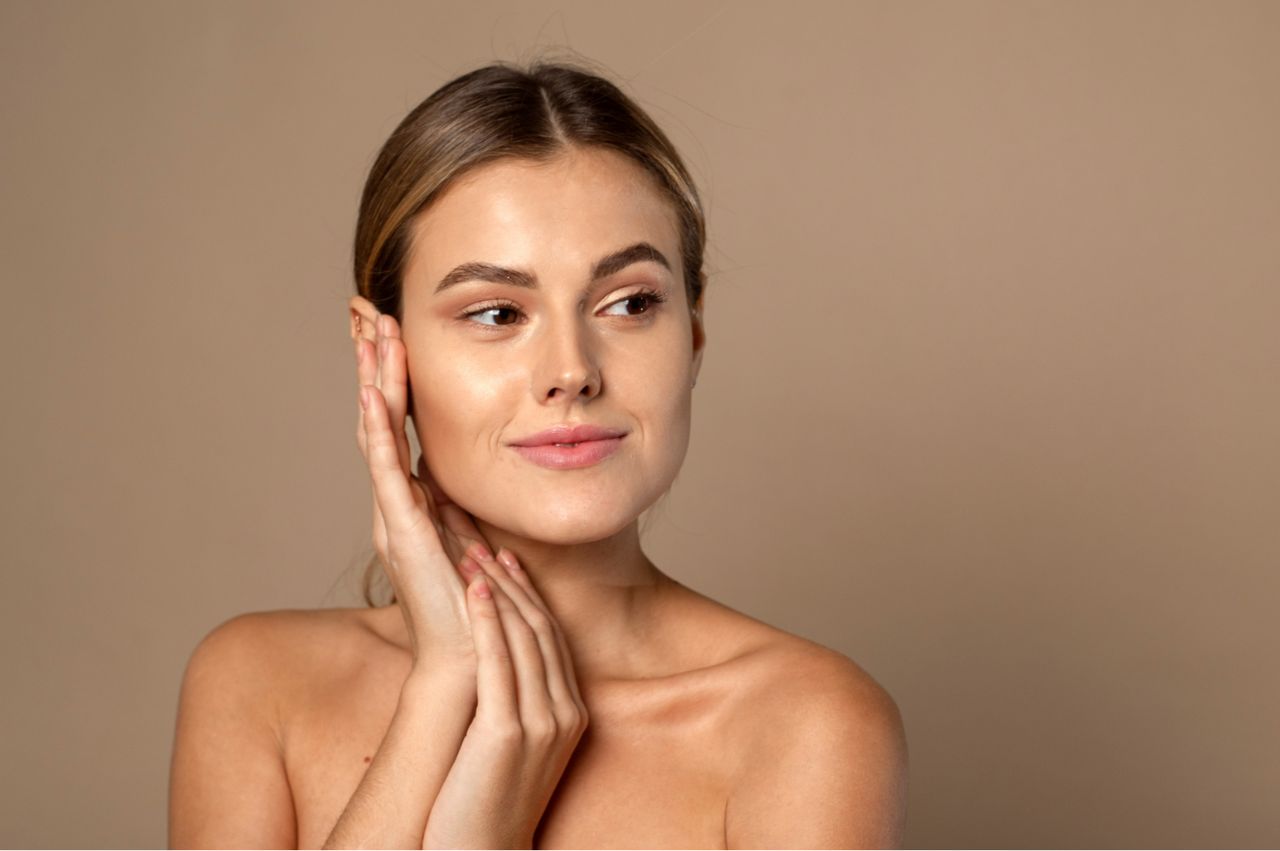 a woman touching her face