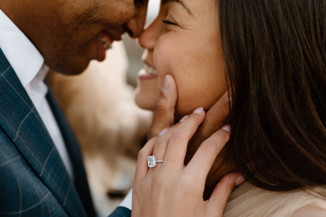 a man and woman touching noses